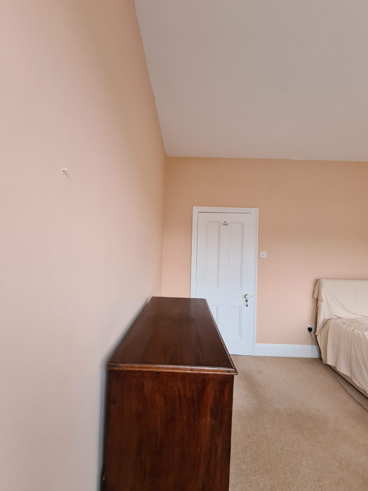 Design ideas for a large classic master bedroom in London with pink walls, carpet, beige floors and a drop ceiling.