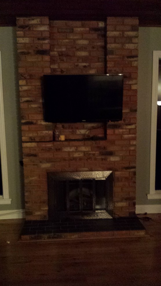 Brick fireplace with cutout and tv
