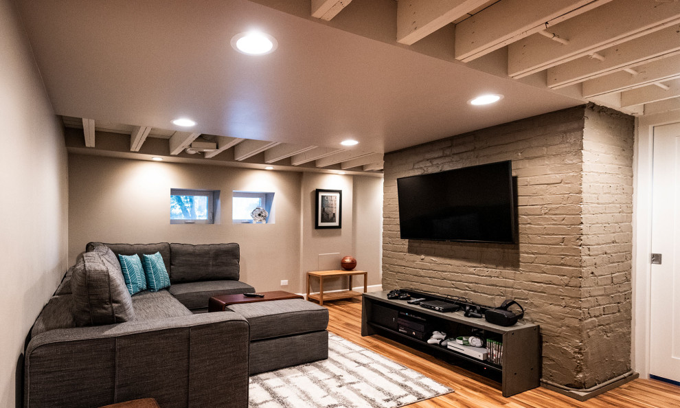 Photo of a small country look-out basement in Chicago with grey walls, vinyl floors and brown floor.