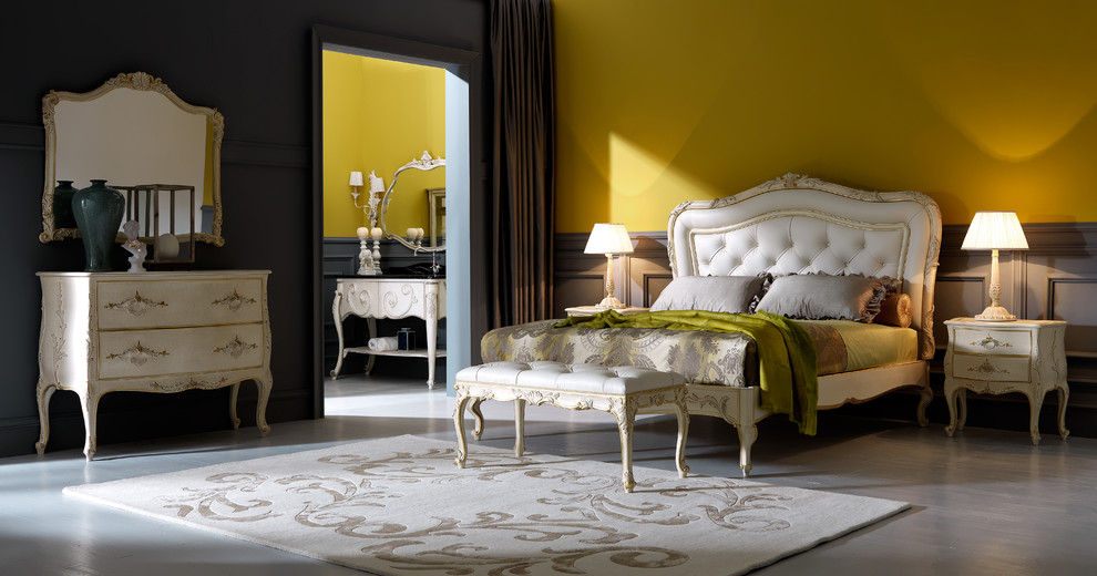 Design ideas for a large mediterranean master bedroom in London with yellow walls and dark hardwood floors.