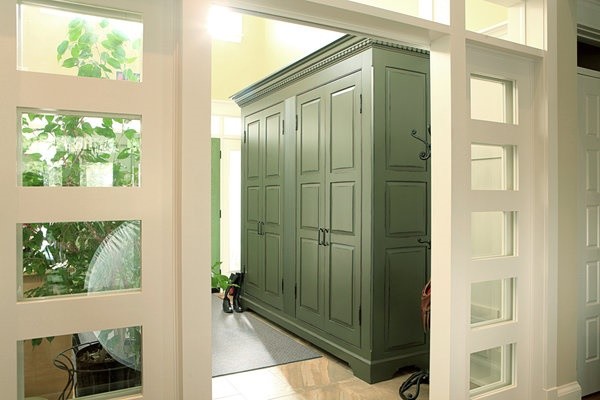 Large contemporary mudroom in Toronto with yellow walls, marble floors, a double front door and a green front door.