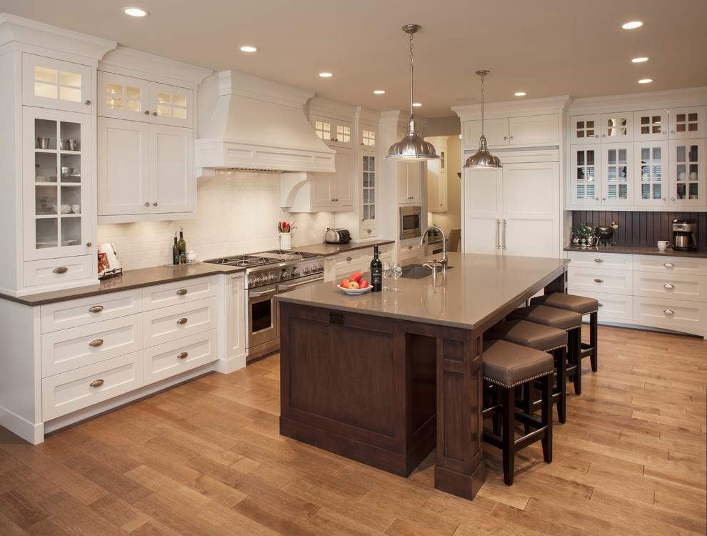Example of a transitional kitchen design in Calgary