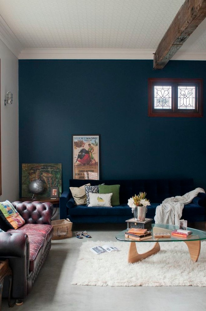 Inspiration for an eclectic living room in Perth with concrete floors and blue walls.