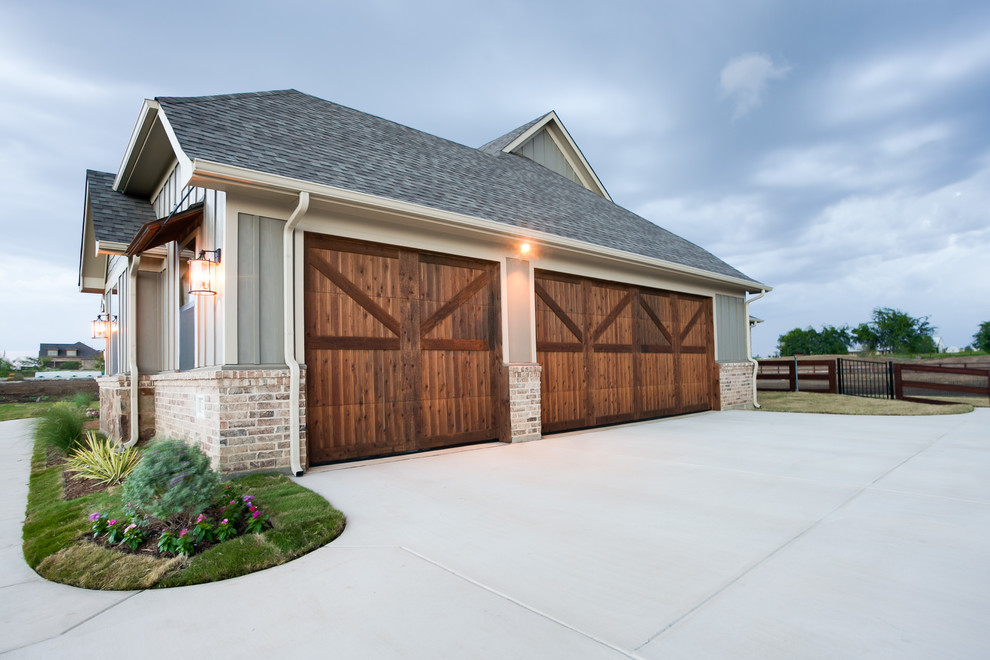 This is an example of a large transitional attached three-car garage in Dallas.
