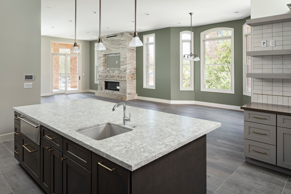 Large transitional galley ceramic tile and gray floor eat-in kitchen photo in Phoenix with an undermount sink, shaker cabinets, gray cabinets, quartz countertops, white backsplash, ceramic backsplash, stainless steel appliances, an island and gray countertops