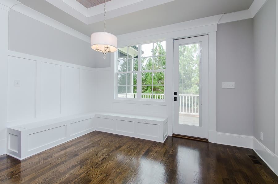 Small transitional dark wood floor and brown floor front door photo in Raleigh with gray walls and a white front door