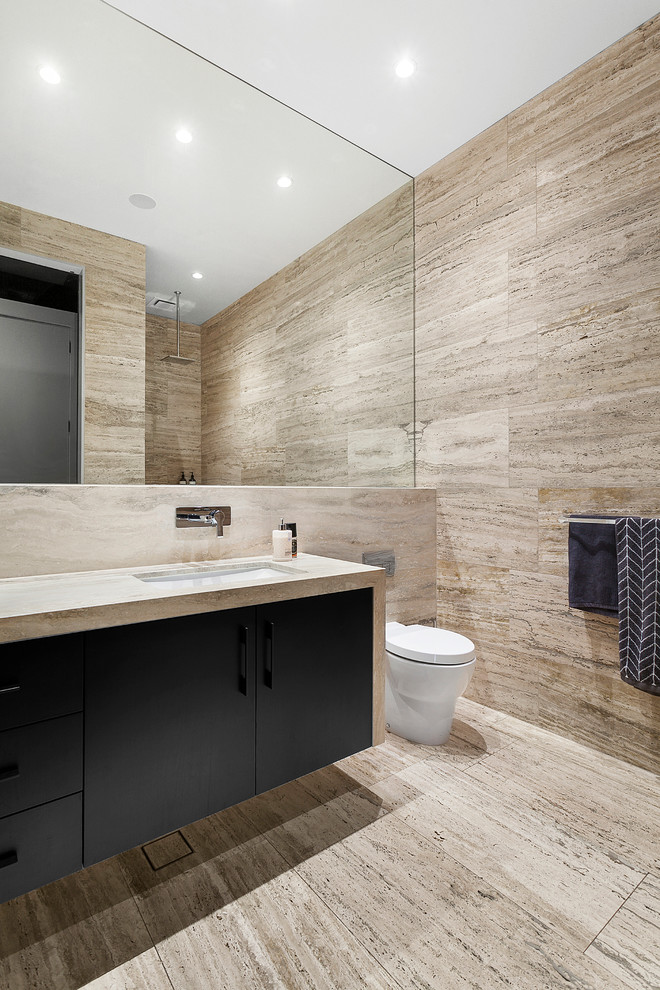 Photo of a contemporary powder room in Melbourne with travertine.