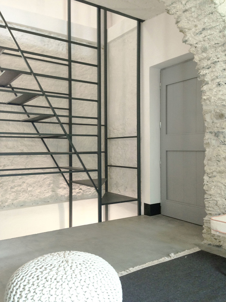 This is an example of a small country metal straight staircase in Milan with open risers.