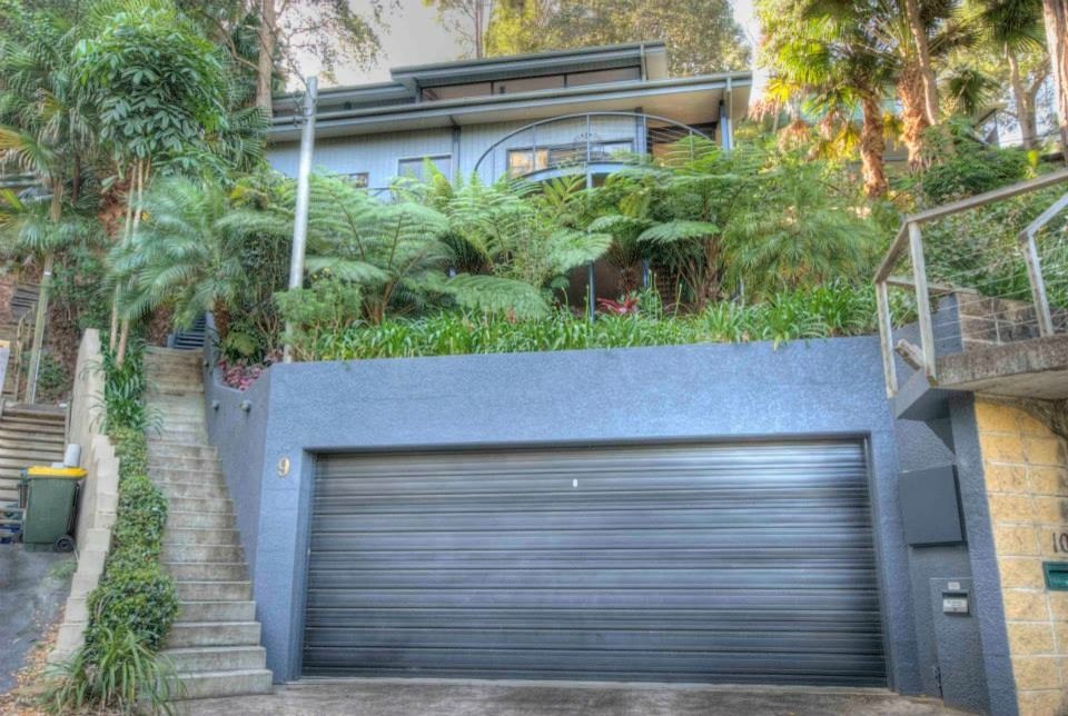 Design ideas for a tropical garage in Sydney.