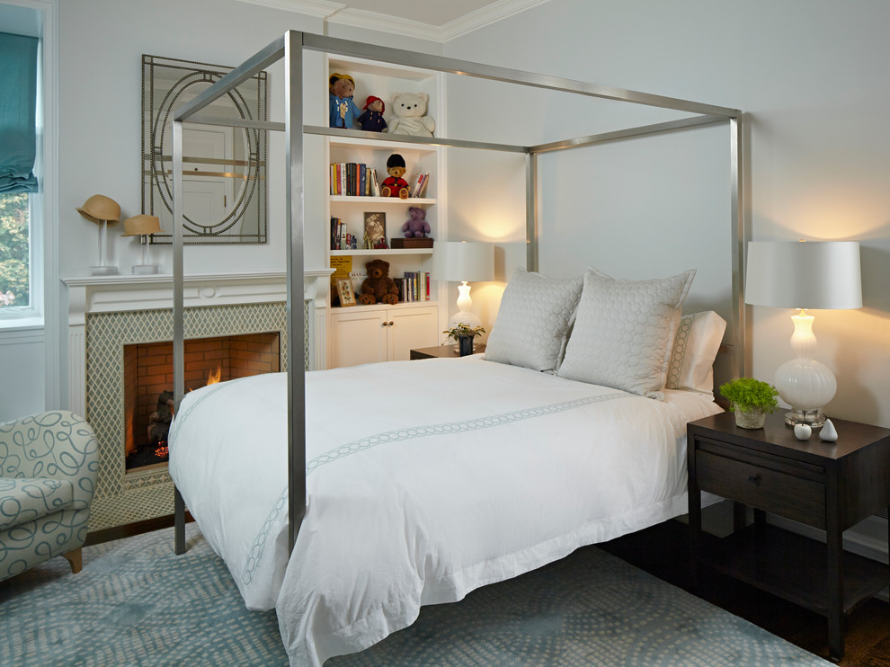 Elegant dark wood floor bedroom photo in Chicago with gray walls and a standard fireplace