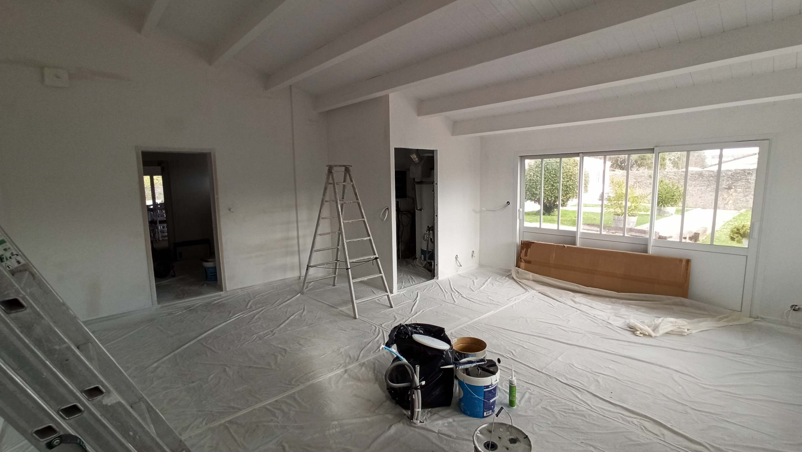 Transformation d'une chambre parentale en pièce de vie/cuisine