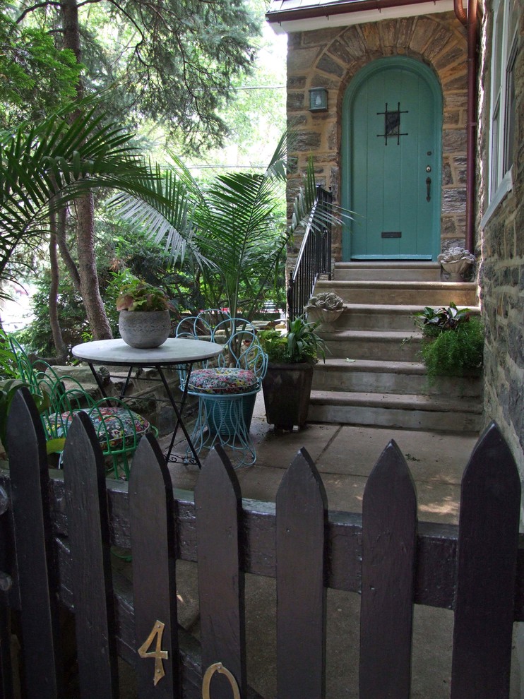 Design ideas for a mediterranean entryway in Philadelphia with a single front door and a green front door.