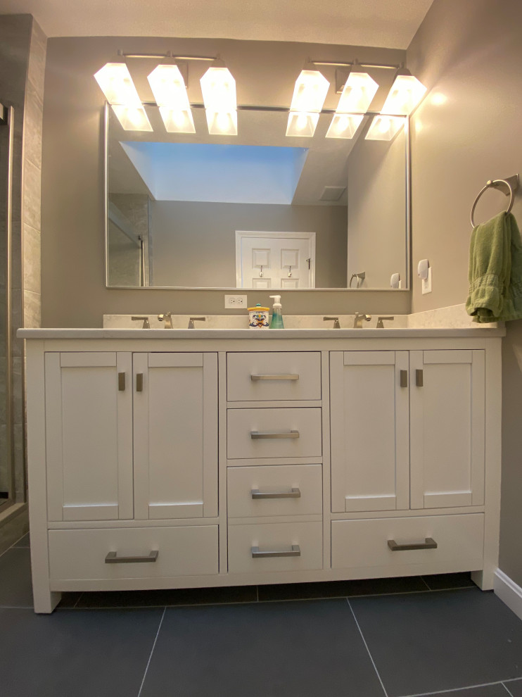 Photo of a small modern cloakroom in Boston with shaker cabinets, white cabinets, a bidet, grey tiles, ceramic tiles, grey walls, ceramic flooring, a submerged sink, engineered stone worktops, grey floors, white worktops and a built in vanity unit.
