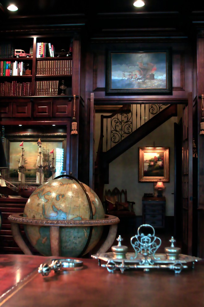 This is an example of a large traditional study room in Dallas with a freestanding desk.