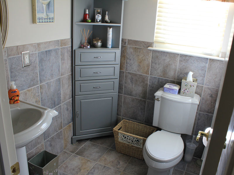Small traditional powder room in Philadelphia with raised-panel cabinets, grey cabinets, a two-piece toilet, beige tile, blue tile, gray tile, ceramic tile, grey walls, ceramic floors, a pedestal sink and multi-coloured floor.