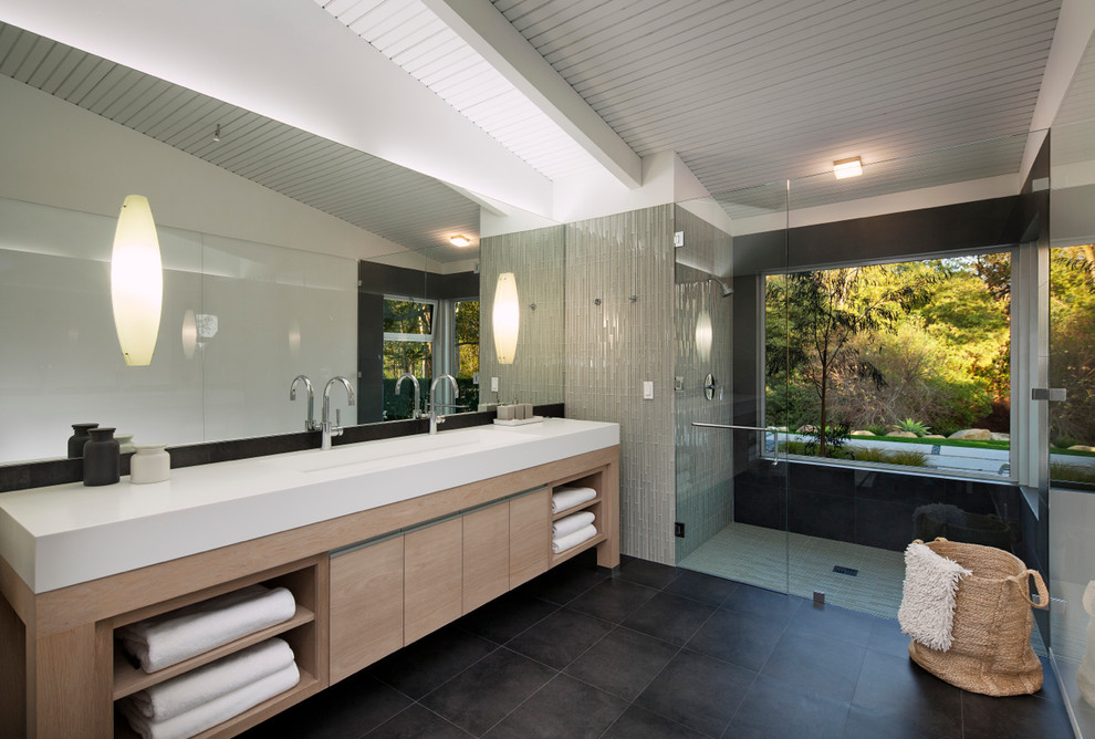 Design ideas for a midcentury bathroom in Santa Barbara with a trough sink, flat-panel cabinets, light wood cabinets, an open shower, gray tile, mosaic tile, white walls and an open shower.