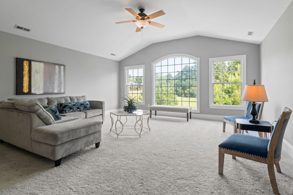 This is an example of a mid-sized modern formal living room in Other with grey walls, carpet and grey floor.