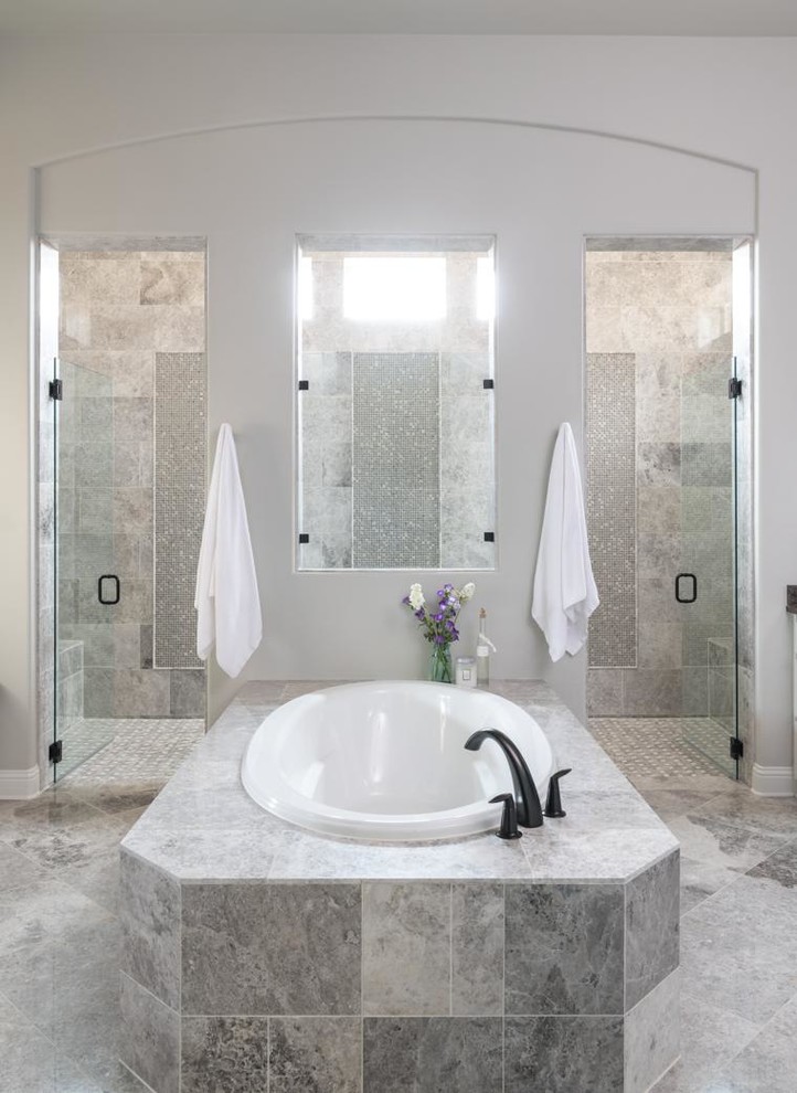 Transitional gray floor drop-in bathtub photo in Dallas with gray walls and a hinged shower door