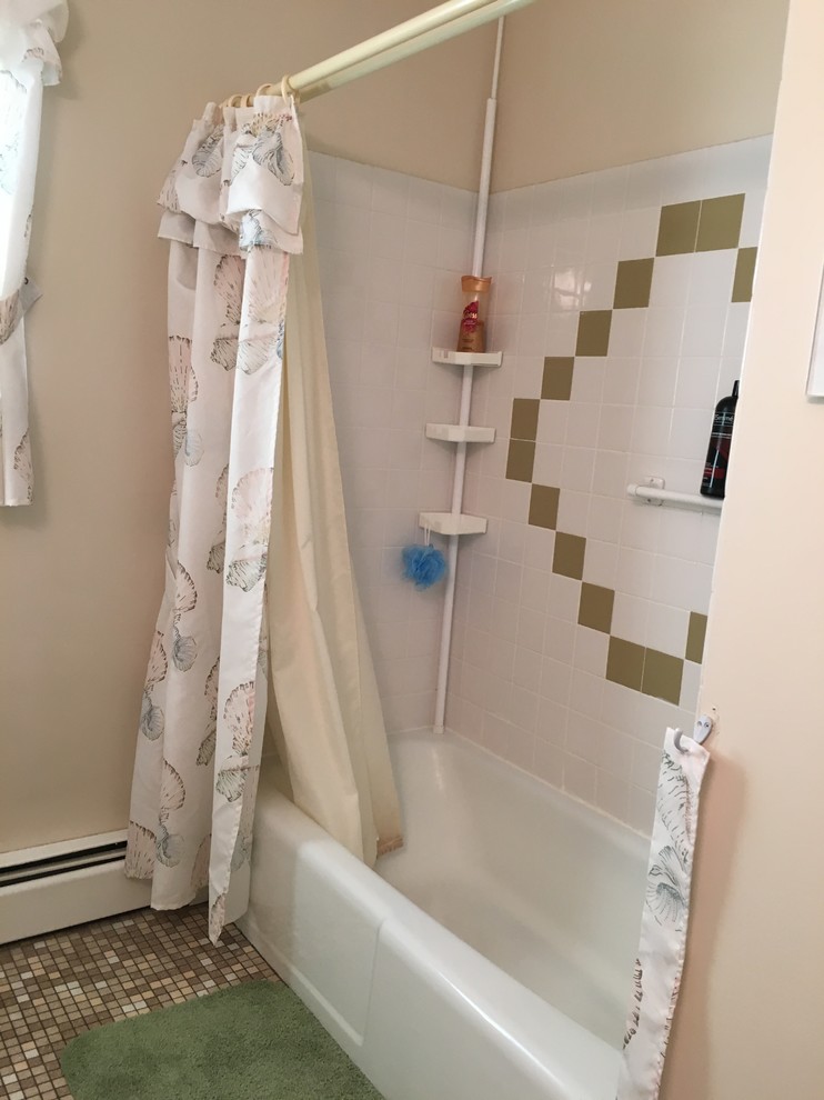 Design ideas for a mid-sized transitional master bathroom in Philadelphia with raised-panel cabinets, white cabinets, an alcove tub, a shower/bathtub combo, a two-piece toilet, blue walls, vinyl floors, an undermount sink and onyx benchtops.