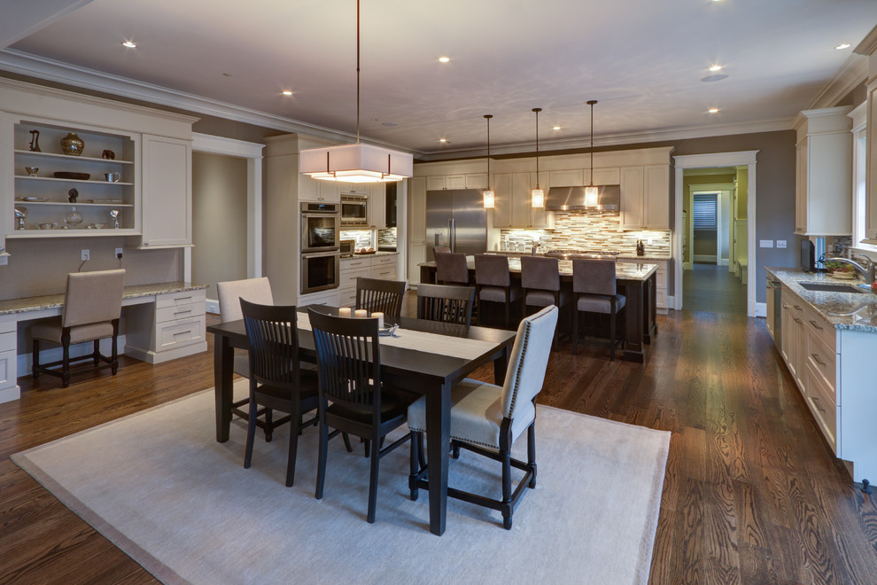 Open concept kitchen - transitional medium tone wood floor open concept kitchen idea in DC Metro with an undermount sink, beaded inset cabinets, white cabinets, granite countertops, gray backsplash, matchstick tile backsplash, stainless steel appliances and an island