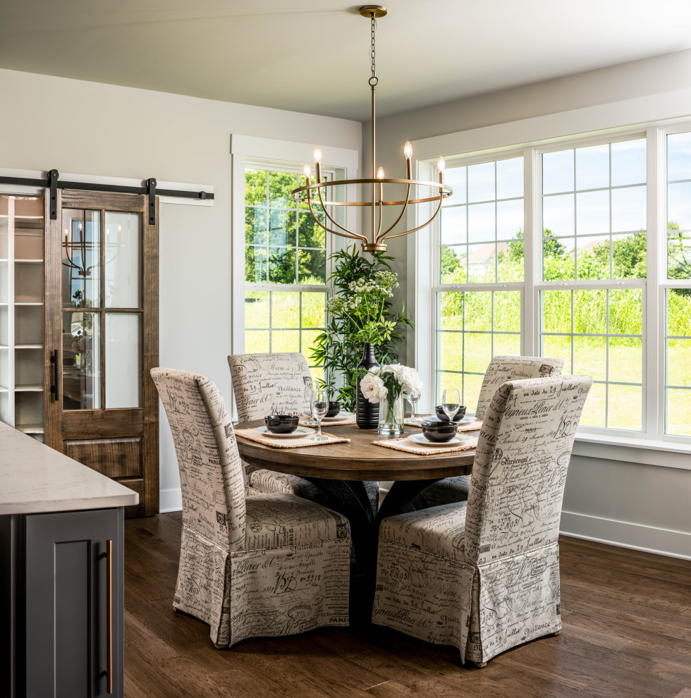 This is an example of a country dining room in Other.