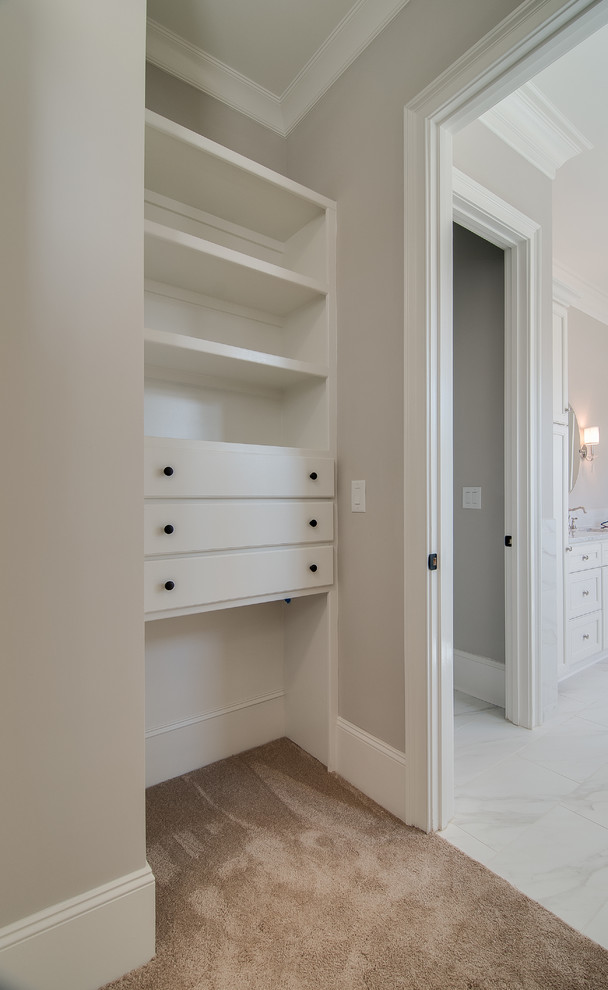 This is an example of a traditional storage and wardrobe in Charlotte.