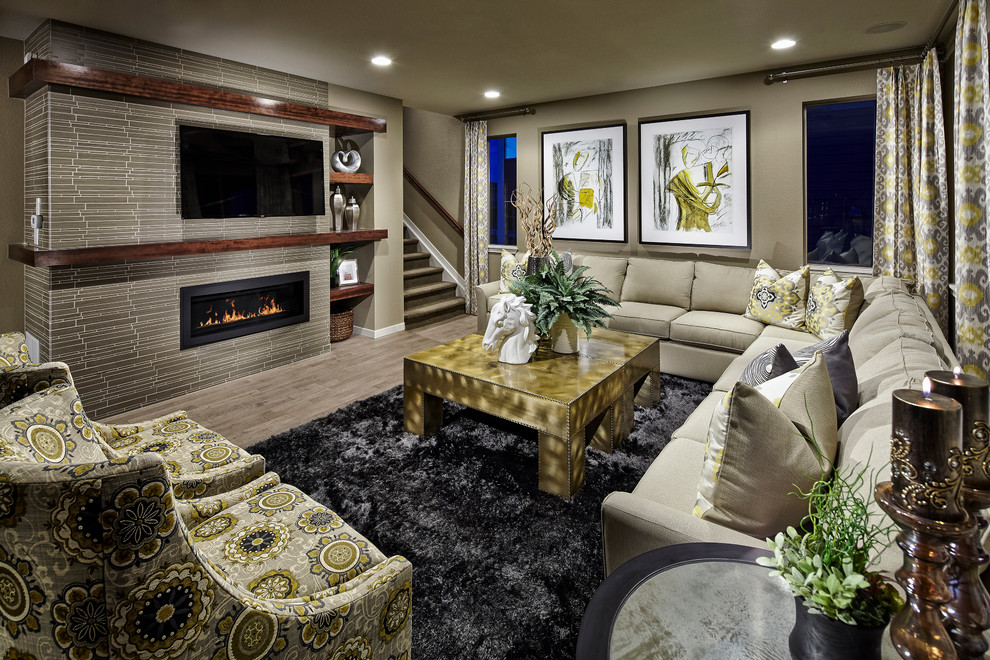 Design ideas for a contemporary family room in Denver with a tile fireplace surround.