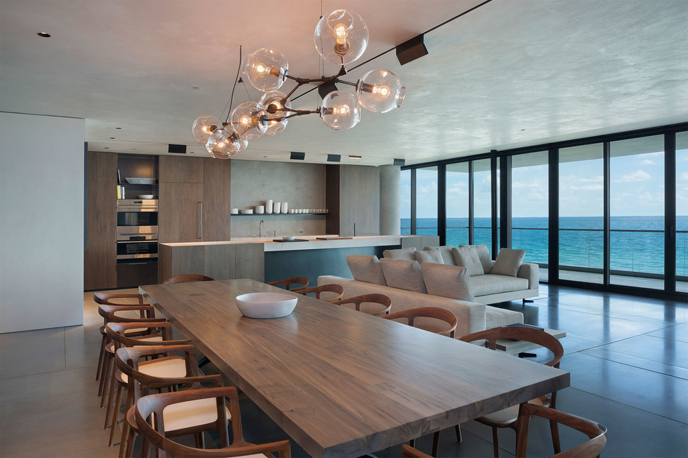 Design ideas for a mid-sized contemporary open plan dining in Miami with multi-coloured walls, no fireplace, porcelain floors and beige floor.