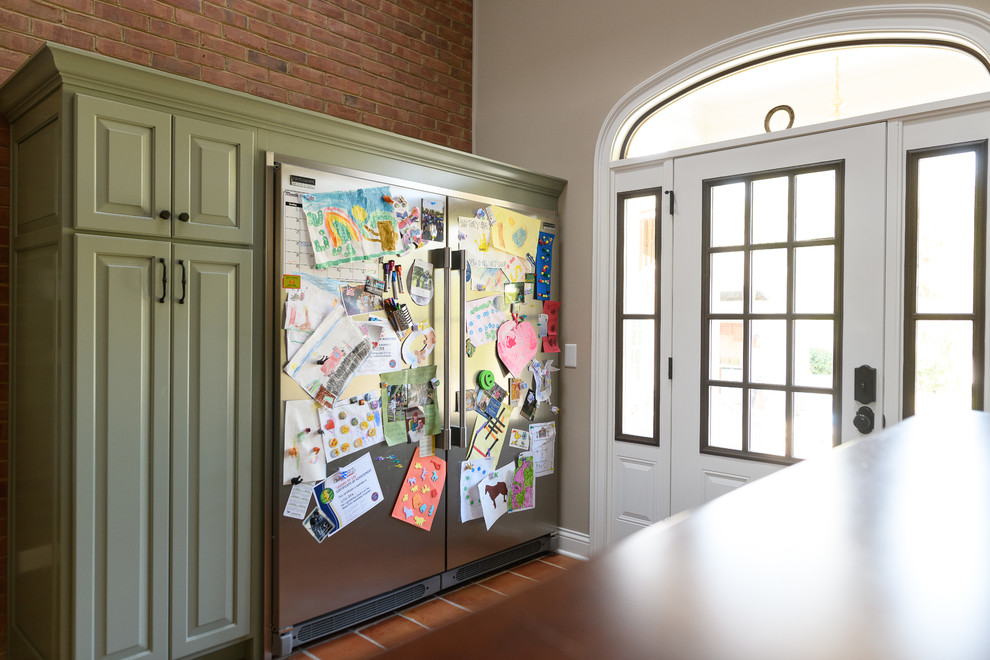 Inspiration for a mid-sized transitional terra-cotta tile front door remodel with beige walls and a dark wood front door