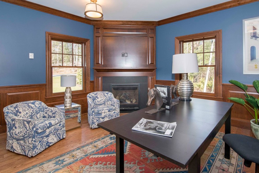 Inspiration for a large traditional home studio in Boston with blue walls, medium hardwood floors and a freestanding desk.