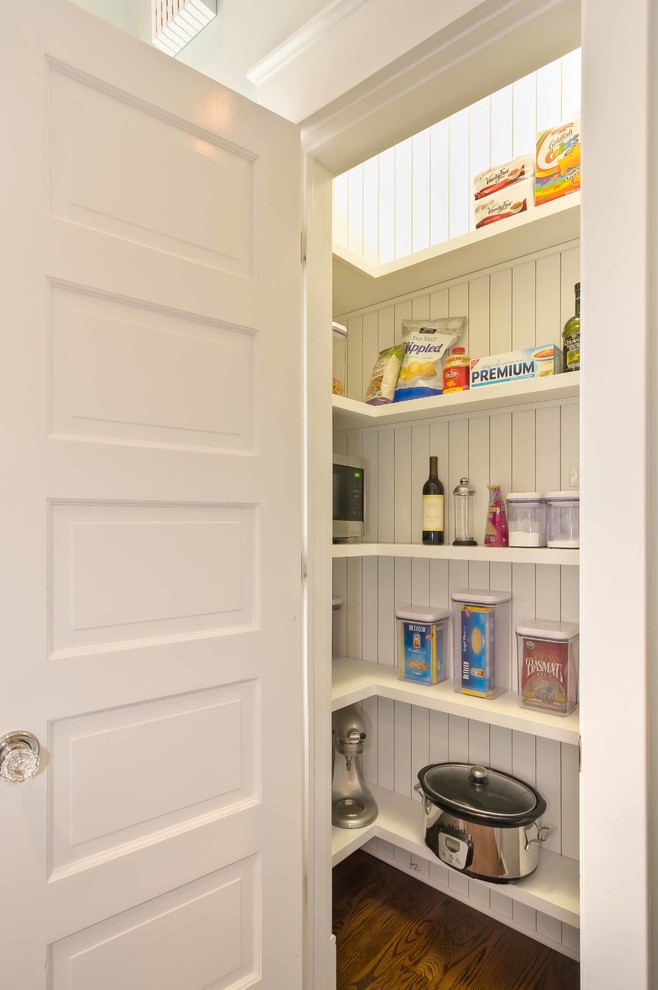 Example of a large transitional galley dark wood floor eat-in kitchen design in Chicago with an integrated sink, shaker cabinets, white cabinets, wood countertops, ceramic backsplash, stainless steel appliances, blue walls and an island