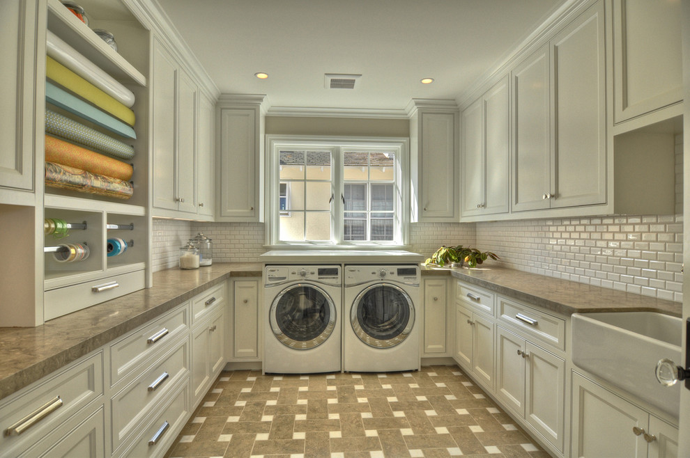 Traditional laundry room in Orange County with a farmhouse sink and white cabinets.