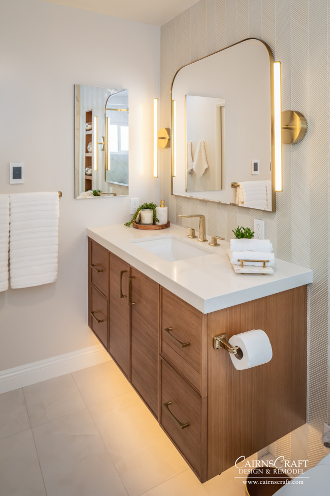 Example of a mid-sized trendy master multicolored tile and glass sheet porcelain tile, white floor and single-sink bathroom design in San Diego with flat-panel cabinets, medium tone wood cabinets, a two-piece toilet, multicolored walls, an integrated sink, quartz countertops, white countertops, a niche and a floating vanity