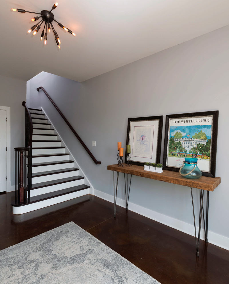Design ideas for a mid-sized transitional foyer in Richmond with grey walls and concrete floors.