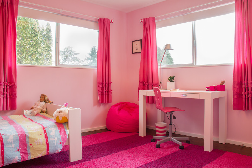 Mid-sized modern kids' bedroom in Portland with pink walls and bamboo floors for kids 4-10 years old and girls.