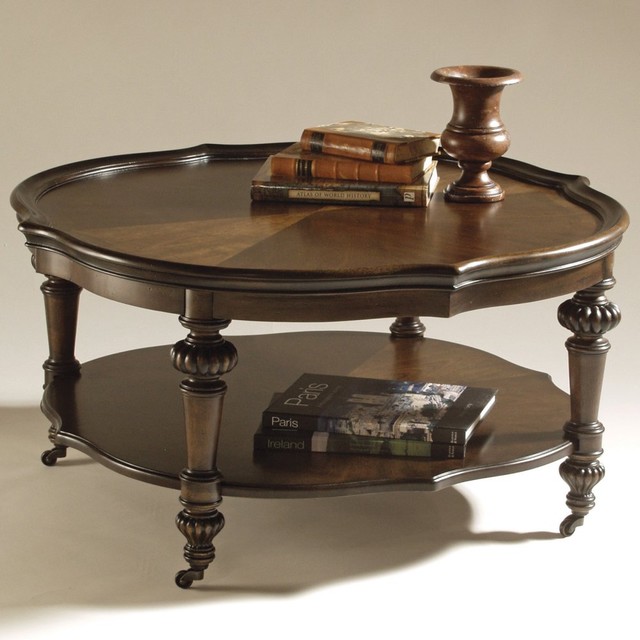 The Magnussen T1255 Ferndale Wood Round Coffee Table has a round shaped thats ac