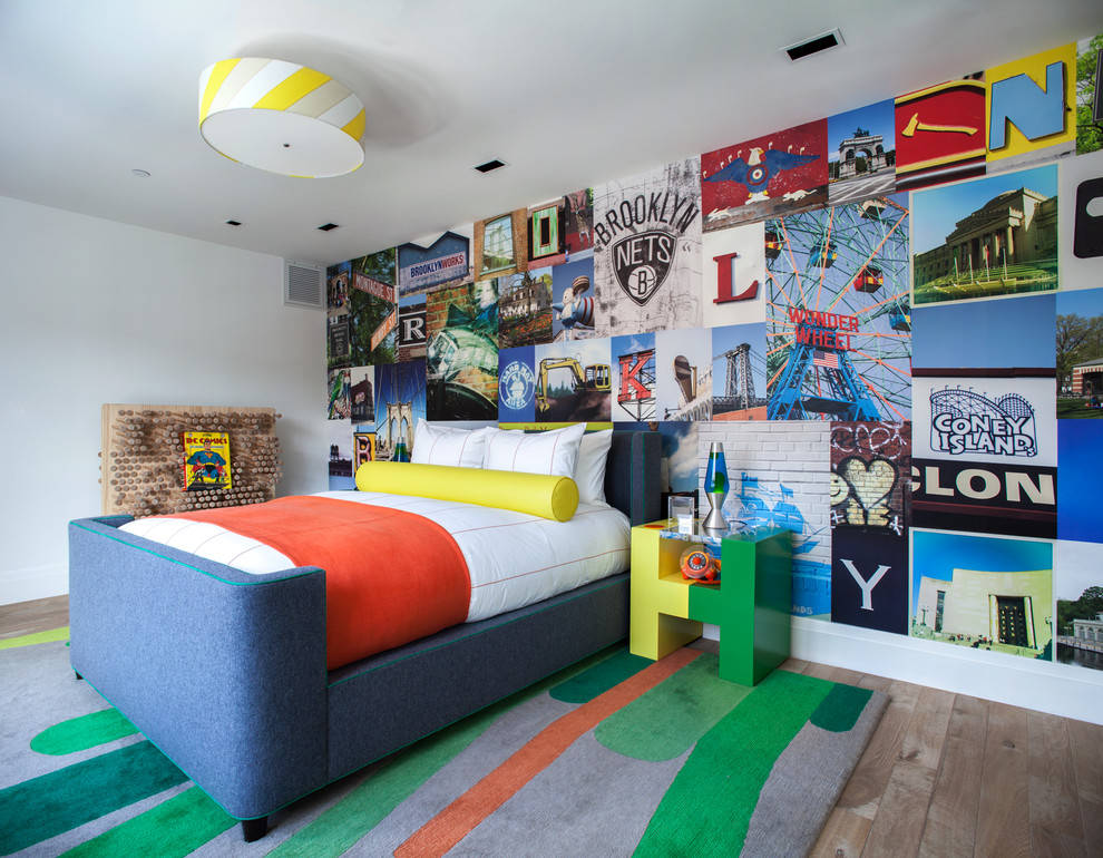 Design ideas for a transitional kids' bedroom for kids 4-10 years old and boys in New York with white walls and medium hardwood floors.