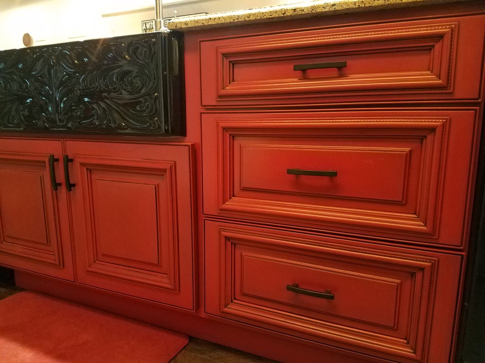 Inspiration for a l-shaped slate floor and multicolored floor kitchen pantry remodel in Cedar Rapids with a double-bowl sink, beaded inset cabinets, red cabinets, black appliances, no island and brown countertops