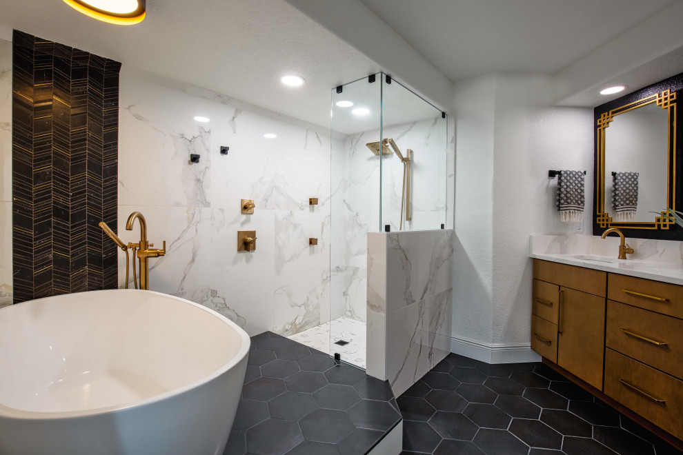Inspiration for an expansive midcentury ensuite bathroom in Orlando with flat-panel cabinets, medium wood cabinets, a freestanding bath, a walk-in shower, black and white tiles, porcelain tiles, black walls, porcelain flooring, a submerged sink, engineered stone worktops, black floors, an open shower, white worktops, an enclosed toilet, double sinks and a built in vanity unit.