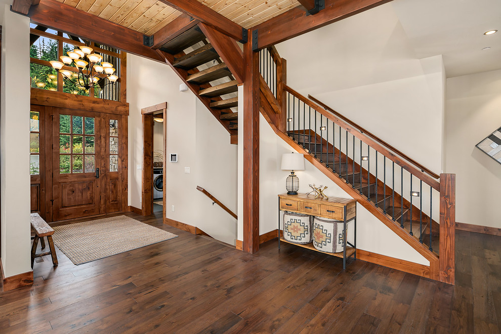 Mountain style wooden l-shaped wood railing staircase photo in Seattle with wooden risers