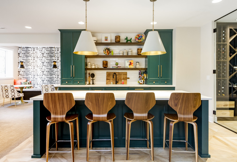Transitional galley seated home bar in Kansas City with recessed-panel cabinets, green cabinets, light hardwood floors, beige floor and white benchtop.