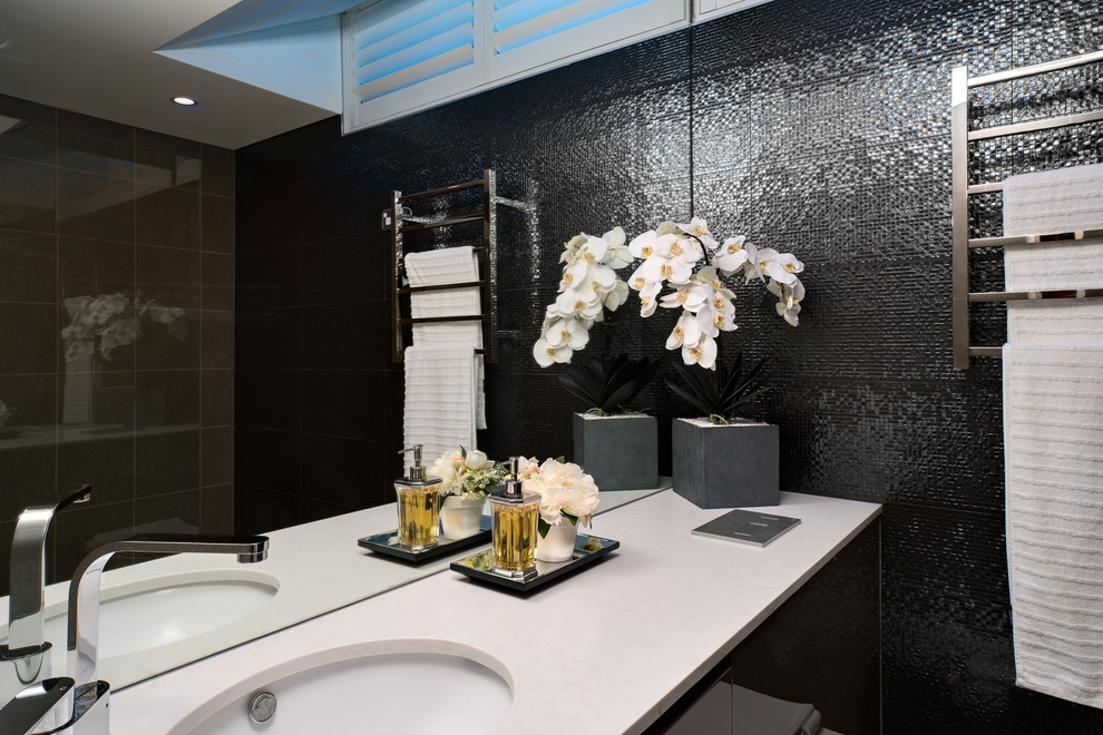 Photo of a small contemporary master bathroom in Sydney with brown cabinets, an alcove shower, brown tile, porcelain tile, white walls, marble floors, a drop-in sink and engineered quartz benchtops.