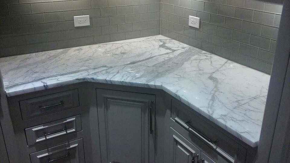 Mid-sized transitional kitchen photo in Dallas with raised-panel cabinets, gray cabinets, marble countertops, gray backsplash and ceramic backsplash