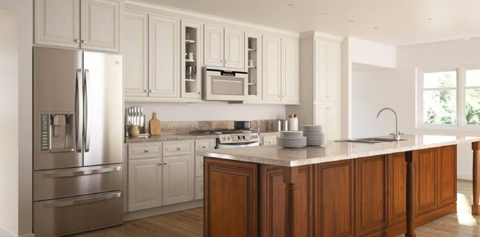 Example of a mid-sized transitional galley medium tone wood floor and brown floor open concept kitchen design with a drop-in sink, raised-panel cabinets, white cabinets, granite countertops, stainless steel appliances, an island and gray countertops