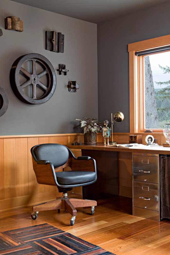 This is an example of an industrial home office in Portland with grey walls.