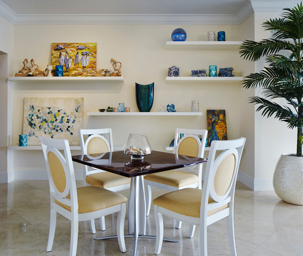 Inspiration for a tropical separate dining room in Miami with yellow walls.