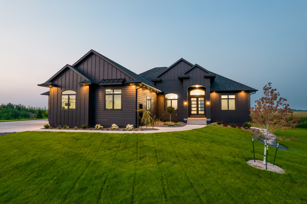 Large black one-story concrete fiberboard and board and batten exterior home photo in Cedar Rapids with a shingle roof and a black roof