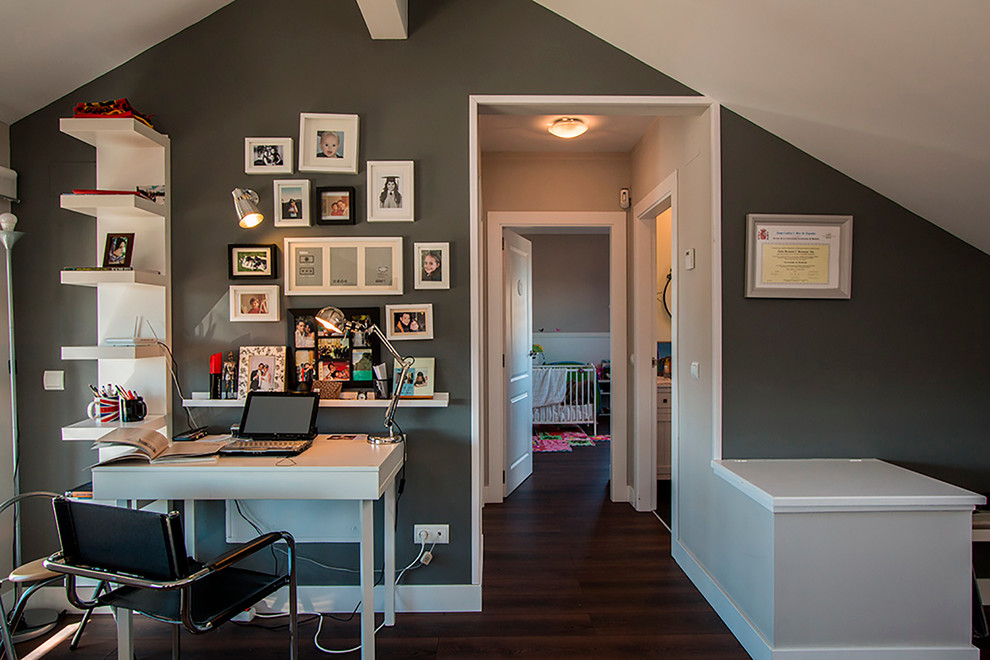This is an example of a mid-sized modern home office in Other with grey walls, dark hardwood floors, no fireplace and a freestanding desk.
