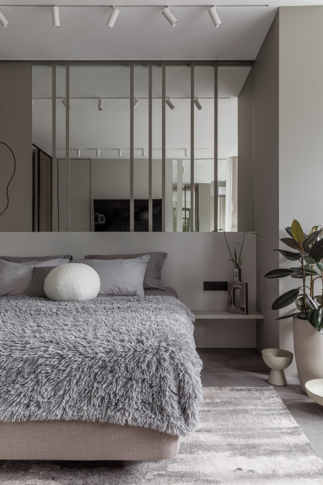 Aménagement d'une chambre grise et blanche contemporaine de taille moyenne avec un mur gris, un sol en vinyl et un sol gris.
