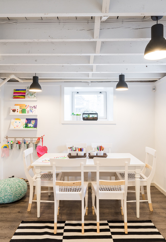Inspiration for a contemporary gender-neutral kids' study room for kids 4-10 years old in Boston with white walls, medium hardwood floors and brown floor.